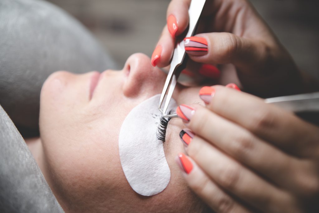 Process of eyelash extensions in the beauty studio. Process close up. Beauty and care for yourself. Soft matte effect.